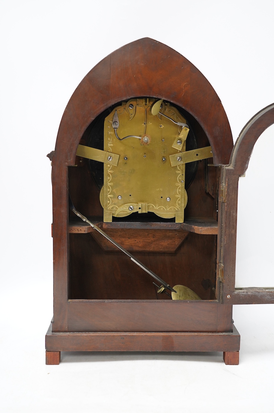 An early 19th century brass inlaid mahogany lancet shaped mantel clock by G. Willson of London, with pendulum and door-key, no winding key, 45cm. Condition - fair to good, not tested as working